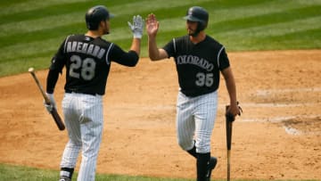 DENVER, CO - SEPTEMBER 4: Chad Bettis #35 of the Colorado Rockies is congratulated after scoring during the fourth inning by Nolan Arenado #28 during a game against the San Francisco Giants at Coors Field on September 4, 2017 in Denver, Colorado. The Rockies defeated the Giants 4-3. (Photo by Justin Edmonds/Getty Images)