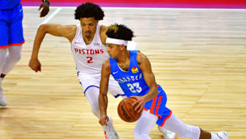 OKC Thunder guard Tre Mann (23) dribbles around Detroit Pistons guard Cade Cunningham: Stephen R. Sylvanie-USA TODAY Sports