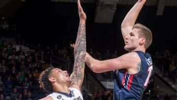 Dec 29, 2015; South Bend, IN, USA; Liberty Flames center Evan Maxwell (15) shoots over Notre Dame Fighting Irish forward Zach Auguste (30) in the first half at the Purcell Pavilion. Mandatory Credit: Matt Cashore-USA TODAY Sports