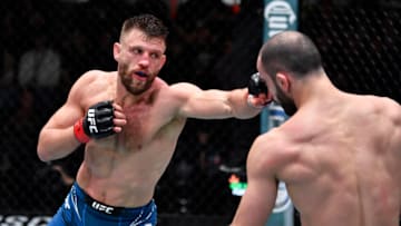 LAS VEGAS, NEVADA - JANUARY 15: (L-R) Calvin Kattar punches Giga Chikadze of Georgia in their featherweight fight during the UFC Fight Night event at UFC APEX on January 15, 2022 in Las Vegas, Nevada. (Photo by Jeff Bottari/Zuffa LLC via Getty Images)