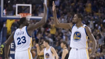 November 28, 2016; Oakland, CA, USA; Golden State Warriors forward Draymond Green (23) and forward Kevin Durant (35) celebrate during the fourth quarter against the Atlanta Hawks at Oracle Arena. The Warriors defeated the Hawks 105-100. Mandatory Credit: Kyle Terada-USA TODAY Sports