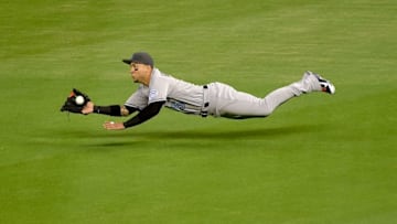 Jun 19, 2016; Miami, FL, USA; Colorado Rockies right fielder Carlos Gonzalez (5) makes a diving catch during the fifth inning against the Miami Marlins at Marlins Park. Mandatory Credit: Steve Mitchell-USA TODAY Sports
