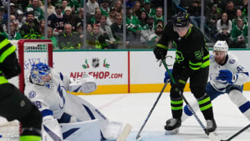 Dec 2, 2023; Dallas, Texas, USA; Dallas Stars center Roope Hintz (24) shoots the puck against Tampa Bay Lightning goaltender Andrei Vasilevskiy (88) during the second period at American Airlines Center. Mandatory Credit: Chris Jones-USA TODAY Sports