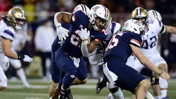 Oct 22, 2021; Tucson, Arizona, USA; Arizona Wildcats running back Jalen John (21) runs with the ball against the Washington Huskies during the second half at Arizona Stadium. Mandatory Credit: Joe Camporeale-USA TODAY Sports