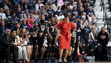 Cincinnati Bearcats head coach Michelle Clark-Heard leads team against UConn Huskies. Getty Images.