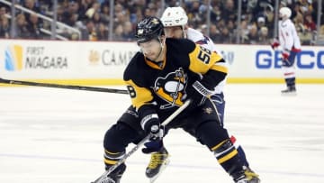 Mar 20, 2016; Pittsburgh, PA, USA; Pittsburgh Penguins defenseman Kris Letang (58) skates with the puck ahead of Washington Capitals left wing Alex Ovechkin (8) during the third period at the CONSOL Energy Center. The Penguins won 6-2. Mandatory Credit: Charles LeClaire-USA TODAY Sports