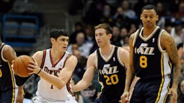 Mar 3, 2014; Milwaukee, WI, USA; Milwaukee Bucks forward Ersan Ilyasova (7) looks for a shot against Utah Jazz guard Gordon Hayward (20) and guard Diante Garrett (8) in the 3rd quarter at BMO Harris Bradley Center. Mandatory Credit: Benny Sieu-USA TODAY Sports