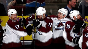 ANAHEIM, CA - NOVEMBER 18: Tyson Jost #17, Patrik Nemeth #12, Matt Calvert #11, and Sven Andrighetto #10 of the Colorado Avalanche celebrate their 4-3 overtime win against the Anaheim Ducks on November 18, 2018 at Honda Center in Anaheim, California. (Photo by Debora Robinson/NHLI via Getty Images)