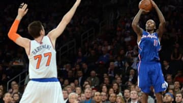 Jan 17, 2014; New York, NY, USA; Los Angeles Clippers shooting guard Jamal Crawford (11) puts up a shot over New York Knicks power forward Andrea Bargnani (77) during the first half at Madison Square Garden. The Los Angeles Clippers won 109-94. Mandatory Credit: Joe Camporeale-USA TODAY Sports