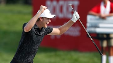 Jul 4, 2021; Detroit, Michigan, USA; Cam Davis celebrates after making an eagle from a greenside bunker on the 17th hole during the final round of the Rocket Mortgage Classic golf tournament. Mandatory Credit: Raj Mehta-USA TODAY Sports