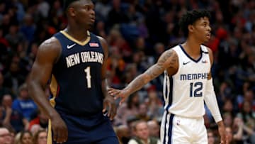 NEW ORLEANS, LOUISIANA - JANUARY 31: Zion Williamson #1 of the New Orleans Pelicans and Ja Morant #12 of the Memphis Grizzlies stand on the court during a NBA game at Smoothie King Center on January 31, 2020 in New Orleans, Louisiana. NOTE TO USER: User expressly acknowledges and agrees that, by downloading and or using this photograph, User is consenting to the terms and conditions of the Getty Images License Agreement. (Photo by Sean Gardner/Getty Images)