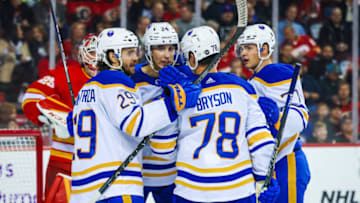 Oct 20, 2022; Calgary, Alberta, CAN; Buffalo Sabres center Dylan Cozens (24) celebrates his goal with teammates against the Calgary Flames during the first period at Scotiabank Saddledome. Mandatory Credit: Sergei Belski-USA TODAY Sports