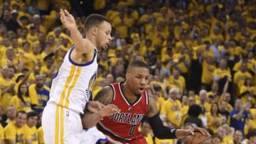 May 11, 2016; Oakland, CA, USA; Portland Trail Blazers guard Damian Lillard (0) dribbles the basketball against Golden State Warriors guard Stephen Curry (30) during the second quarter in game five of the second round of the NBA Playoffs at Oracle Arena. Mandatory Credit: Kyle Terada-USA TODAY Sports
