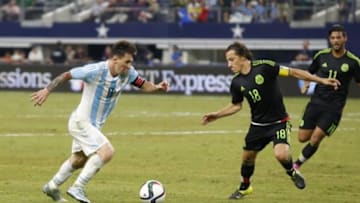 Sep 8, 2015; Arlington, TX, USA; Argentina forward Lionel Messi (10) controls the ball against Mexico midfielder Andres Guardado (18) and forward Carlos Vela (11) at AT&T Stadium. Mandatory Credit: Matthew Emmons-USA TODAY Sports