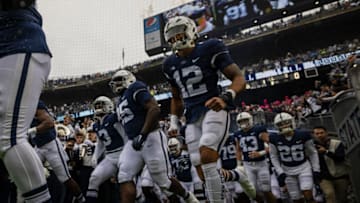 STATE COLLEGE, PA - OCTOBER 23: Brandon Smith #12 of the Penn State Nittany Lions takes the field with teammates before the game against the Illinois Fighting Illini at Beaver Stadium on October 23, 2021 in State College, Pennsylvania. (Photo by Scott Taetsch/Getty Images)