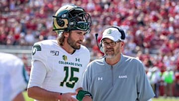 Collin Hill #15 talks with Head Coach Mike Bobo. (Photo by Wesley Hitt/Getty Images)