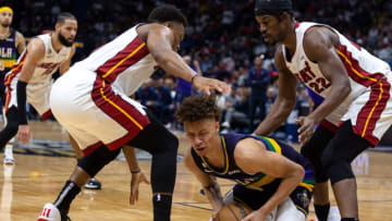 New Orleans Pelicans guard Dyson Daniels (11) looks to pass the ball against Miami Heat guard Kyle Lowry (7) and forward Jimmy Butler (22)(Stephen Lew-USA TODAY Sports)