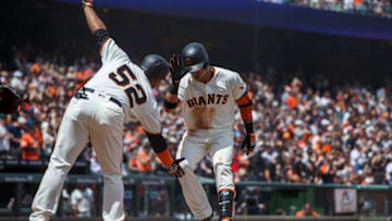 SAN FRANCISCO, CA - MAY 20: Gorkys Hernandez #7 of the San Francisco Giants is congratulated by Miguel Gomez #52 after hitting a two run home run against the Colorado Rockies during the fifth inning at AT&T Park on May 20, 2018 in San Francisco, California. The San Francisco Giants defeated the Colorado Rockies 9-5. (Photo by Jason O. Watson/Getty Images)