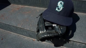 Jun 19, 2014; San Diego, CA, USA; A detailed view a of a Seattle Mariners glove and hat before a game against the San Diego Padres at Petco Park. Mandatory Credit: Jake Roth-USA TODAY Sports