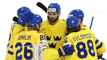 Sweden's William Nylander (front R) celebrates his opening 1-0 goal with teammates with Sweden's forward Lucas Wallmark (L), Sweden's defender Rasmus Dahlin (front L), Sweden's forward Emil Bemstrom (72) and Rasmus Asplund (R hidden) during the IIHF Ice Hockey World Championships preliminary round group B match between Sweden and Latvia at the Nokia Arena in Tampere, Finland, on May 24, 2022. - Finland OUT (Photo by Jussi Nukari / Lehtikuva / AFP) / Finland OUT (Photo by JUSSI NUKARI/Lehtikuva/AFP via Getty Images)