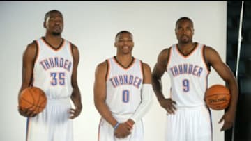 Sep 28, 2015; Oklahoma City, OK, USA; Oklahoma City Thunder forward Kevin Durant (35), Oklahoma City Thunder forward Serge Ibaka (9) and Oklahoma City Thunder guard Russell Westbrook (0) pose for photos during media day at Chesapeake Energy Arena. Mandatory Credit: Mark D. Smith-USA TODAY Sports