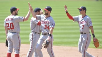 Jul 27, 2016; Cleveland, OH, USA; Washington Nationals second baseman Daniel Murphy (20), right fielder Bryce Harper (34) and center fielder Trea Turner (7) celebrate a 4-1 win over the Cleveland Indians at Progressive Field. Mandatory Credit: David Richard-USA TODAY Sports