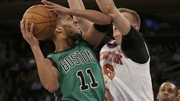 Feb 2, 2016; New York, NY, USA; Boston Celtics guard Evan Turner (11) drives to the basket against New York Knicks forward Kristaps Porzingis (6) during the second half of an NBA basketball game at Madison Square Garden. The Celtics defeated the Knicks 97-89. Mandatory Credit: Adam Hunger-USA TODAY Sports