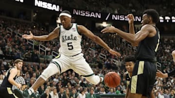 EAST LANSING, MICHIGAN - JANUARY 08: Cassius Winston #5 of the Michigan State Spartans loses control of the ball next to Aaron Wheeler #1 of the Purdue Boilermakers during the first half at Breslin Center on January 08, 2019 in East Lansing, Michigan. (Photo by Gregory Shamus/Getty Images)