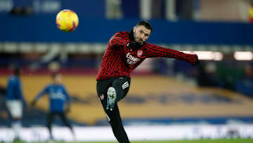 LIVERPOOL, ENGLAND - DECEMBER 19: Sead Kolasinac of Arsenal warms up prior to the Premier League match between Everton and Arsenal at Goodison Park on December 19, 2020 in Liverpool, England. A limited number of fans (2000) are welcomed back to stadiums to watch elite football across England. This was following easing of restrictions on spectators in tiers one and two areas only. (Photo by Clive Brunskill/Getty Images)