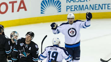 Apr 7, 2016; San Jose, CA, USA; Winnipeg Jets center Mark Scheifele (55) celebrates scoring a goal against the San Jose Sharks in the third period at SAP Center at San Jose. Winnipeg won 5-4. Mandatory Credit: John Hefti-USA TODAY Sports