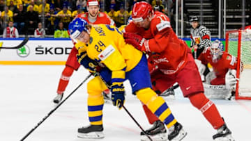 Belarus' Yegor Sharangovich (R) and Sweden's Lias Andersson fight for the puck during the 2018 IIHF Men's Ice Hockey World Championship match between Sweden and Belarus on May 4, 2018 in Copenhagen. (Photo by Jonathan NACKSTRAND / AFP) (Photo credit should read JONATHAN NACKSTRAND/AFP/Getty Images)