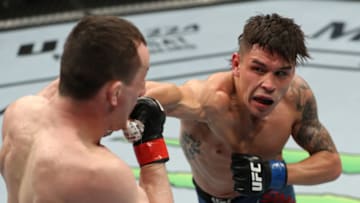 ATLANTIC CITY, NJ - APRIL 21: (R-L) Ricky Simon punches Merab Dvalishvili of Georgia in their bantamweight fight during the UFC Fight Night event at the Boardwalk Hall on April 21, 2018 in Atlantic City, New Jersey. (Photo by Patrick Smith/Zuffa LLC/Zuffa LLC via Getty Images)