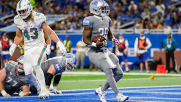 Detroit Lions running back Jamaal Williams (30) scores a touchdown against Miami Dolphins during the first half at Ford Field in Detroit on Sunday, Oct. 30, 2022.