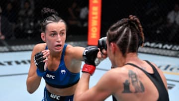 LAS VEGAS, NEVADA - OCTOBER 02: In this handout photo provided by UFC, (L-R) Casey O'Neill of Australia punches Antonina Shevchenko of Kyrgyzstan in their women's flyweight bout during the UFC Fight Night event at UFC APEX on October 02, 2021 in Las Vegas, Nevada. (Photo by Jeff Bottari/Zuffa LLC via Getty Images)