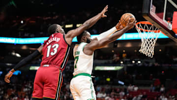 Boston Celtics guard Jaylen Brown (7) lays up the ball as Miami Heat center Bam Adebayo (13) defends(Rich Storry-USA TODAY Sports)