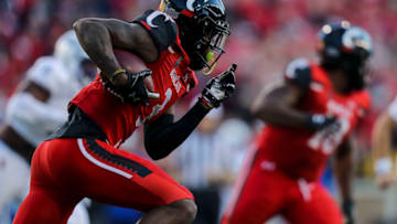 Cincinnati Bearcats safety Ja'von Hicks runs the ball after against the Tulsa Golden Hurricane. USA Today.