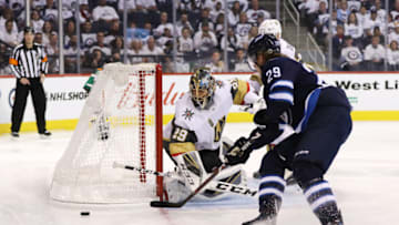 WINNIPEG, MB - MAY 12: Marc-Andre Fleury #29 of the Vegas Golden Knights defends the net against Patrik Laine #29 of the Winnipeg Jets during the second period in Game One of the Western Conference Finals during the 2018 NHL Stanley Cup Playoffs at Bell MTS Place on May 12, 2018 in Winnipeg, Canada. (Photo by Elsa/Getty Images)