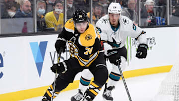 Oct 24, 2021; Boston, Massachusetts, USA; Boston Bruins left wing Jake DeBrusk (74) controls the puck ahead of San Jose Sharks right wing Timo Meier (28) during the third period at TD Garden. Mandatory Credit: Bob DeChiara-USA TODAY Sports