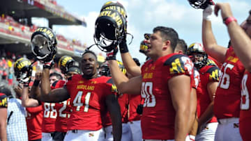 Sep 5, 2015; College Park, MD, USA; Maryland Terrapins defensive lineman Jesse Aniebonam (41) celebrates a win against the Richmond Spiders at Byrd Stadium. Maryland won 50-21. Mandatory Credit: Derik Hamilton-USA TODAY Sports
