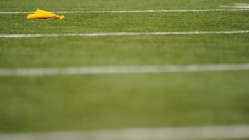 MINNEAPOLIS, MN - AUGUST 9: A penalty flag is seen on the field during the preseason game between the Minnesota Vikings and the Houston Texans on August 9, 2013 at Mall of America Field at the Hubert H. Humphrey Metrodome in Minneapolis, Minnesota. (Photo by Hannah Foslien/Getty Images)