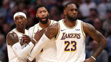 DENVER, COLORADO - DECEMBER 03: Anthony Davis #3 of the Los Angeles Lakers is restrained by Kentavious Caldwell-Pope #1 and Lebron James #23 after being called for a foul against the Denver Nuggets in the third quarter at Pepsi Center on December 03, 2019 in Denver, Colorado. NOTE TO USER: User expressly acknowledges and agrees that, by downloading and or using this photograph, User is consenting to the terms and conditions of the Getty Images License Agreement. (Photo by Matthew Stockman/Getty Images)