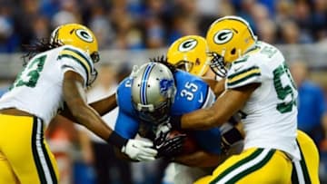 Nov 28, 2013; Detroit, MI, USA; Detroit Lions running back Joique Bell (35) is tackled by Green Bay Packers inside linebacker Brad Jones (59) during the first quarter of a NFL football game on Thanksgiving at Ford Field. Mandatory Credit: Andrew Weber-USA TODAY Sports