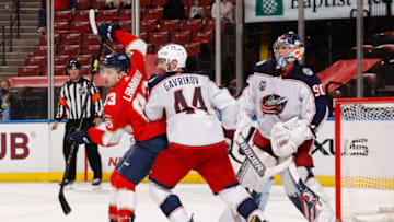 SUNRISE, FL - APRIL 19: Vladislav Gavrikov #44 and Elvis Merzlikins #90 of the Columbus Blue Jackets defend against Juho Lammikko #83 of the Florida Panthers during their game at the BB&T Center on April 19, 2021 in Sunrise, Florida. (Photo by Joel Auerbach/Getty Images)