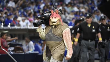 SAN DIEGO, CA - SEPTEMBER 1: Television cameraman Ron Sharek, dressed as Star Wars's Jar Jar Binks, walks on the field before a baseball game between the San Diego Padres and the Los Angeles Dodgers at PETCO Park on September 1, 2017 in San Diego, California. The costume was part of Star Wars Night at the baseball game. (Photo by Denis Poroy/Getty Images)