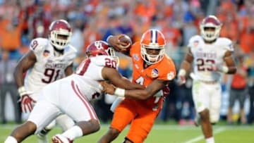 Dec 31, 2015; Miami Gardens, FL, USA; Clemson Tigers quarterback Deshaun Watson (4) is brought down by Oklahoma Sooners linebacker Frank Shannon (20) during the second quarter of the 2015 CFP semifinal at the Orange Bowl at Sun Life Stadium. Mandatory Credit: Robert Duyos-USA TODAY Sports