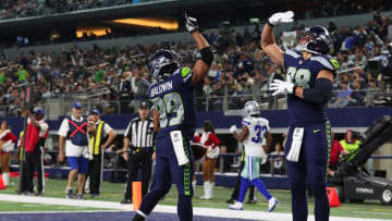 ARLINGTON, TX - DECEMBER 24: Doug Baldwin #89 of the Seattle Seahawks celebrates a fourth quarter touchow with Jimmy Graham #88 of the Seattle Seahawks against the Dallas Cowboys at AT&T Stadium on December 24, 2017 in Arlington, Texas. (Photo by Tom Pennington/Getty Images)