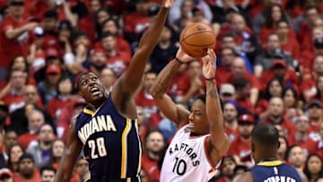 May 1, 2016; Toronto, Ontario, CAN; Toronto Raptors guard DeMar DeRozan (10) tries for a shot as Indiana Pacers center Ian Mahinmi (28) defends in game seven of the first round of the 2016 NBA Playoffs at Air Canada Centre. Mandatory Credit: Dan Hamilton-USA TODAY Sports