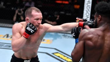 Mar 6, 2021; Las Vegas, NV, USA; Petr Yan of Russia punches Aljamain Sterling in their UFC bantamweight championship fight during the UFC 259 event at UFC APEX on March 06, 2021 in Las Vegas, Nevada. Mandatory Credit: Jeff Bottari/Handout Photo via USA TODAY Sports