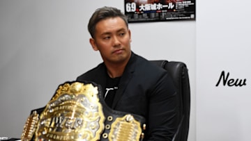 TOKYO, JAPAN - JUNE 08: IWGP Heavy Weight Champion Kazuchika Okada speaks during the Dominion 6.9 In Osaka-Jo Hall press conference of NJPW on June 08, 2019 in Tokyo, Japan. (Photo by Etsuo Hara/Getty Images)