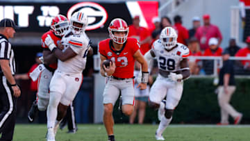 ATHENS, GA - OCTOBER 08: Stetson Bennett #13 of the Georgia Bulldogs breaks loose for a touchdown in the second half against the Auburn Tigers at Sanford Stadium on October 8, 2022 in Athens, Georgia. (Photo by Todd Kirkland/Getty Images)